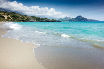 Empty beach against mountain