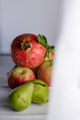 apples and pears on wooden table