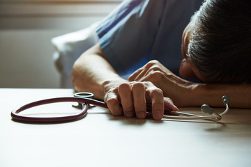 An adult male burnout doctor feeling tired 