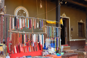 The street stall with ornaments and souvenirs in front of the traditional house in Gokarna, the...