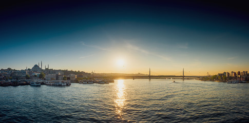 Naklejka premium View of ship at harbor with bridge in the background