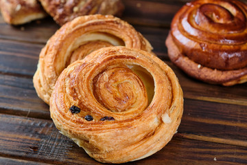 buns with berry jam on a dark wooden background. Rustic style. Close-up. Selective focus