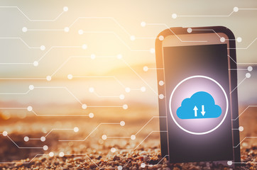Smart phone on tropical sunset beach with cloud icon and line dot abstract background. Technology business and travel nature concept.