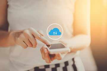 Woman hand using smart phone with cloud icon at outdoor park street background. Copy space of technology business and travel holiday concept.