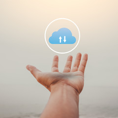 Man open hand raise up on sky background with cloud icon abstract at tropical beach.  Freedom feel good and technology business concept.