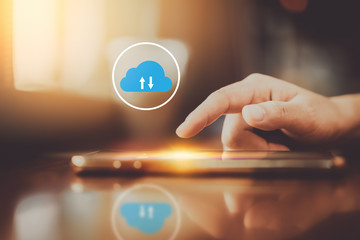 Woman hand using smart phone with cloud icon abstract background at coffee shop. Technology business and modern lifestyle concept.