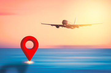 Airplane flying over blur tropical beach and sunset sky abstract background with navigator gps...