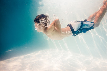 Boy swimming underwater