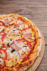 Pepperoni Pizza with Mozzarella cheese, Ham, Tomatoes, pepper, Spices . Italian pizza.