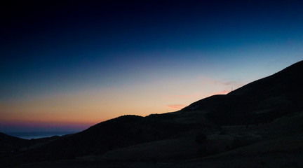 Silhouette of mountains on the island of Crete at dusk, Greece