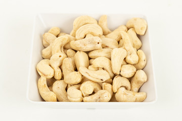 Cashew nut nut dried fruit in bowl on white background