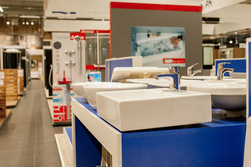 Picture of ceramic wash basin with chrome tap in bathroom fitment store