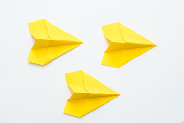 Business correspondence. Yellow paper airplanes isolated on white background. Copy space.