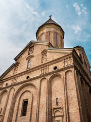 Norashen Armenian Apostolic church in Tbilisi, located in the Old Town, shot against blue sky with light clouds in the middle of day