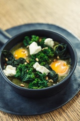 green omelette shakshuka with feta cheese and spinach