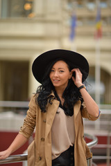 Beautiful brunette fashionable woman posing in Bucharest.