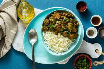 vegetable curry with pumpkin and mushrooms. with rice on the table. healthy indian food. shot from above. copy space