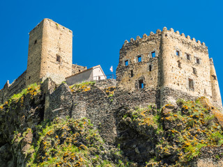 Khertvisi fortress in Georgia with Georgian flag near ruins