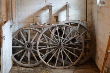 Fototapeta premium Old wagon wheels in the barn