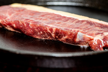 A fresh steak on the chopping board