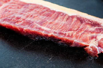 A fresh steak on the chopping board