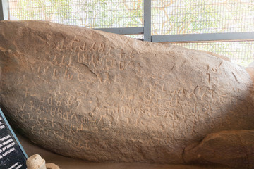 Rock edict of Emperor Ashoka on rock boulder at Maski, Raichur, India - obrazy, fototapety, plakaty