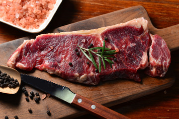 A fresh steak on the chopping board