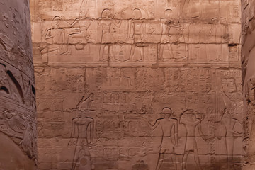 Hieroglyphs on wall of Karnak Temple Complex, famous architectural landmark in Luxor, Egypt.