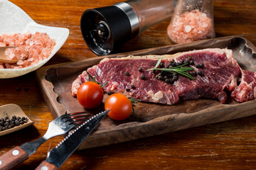 A fresh steak on the chopping board