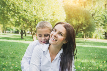 Fototapeta premium happy family concept, mom and her son outdoors