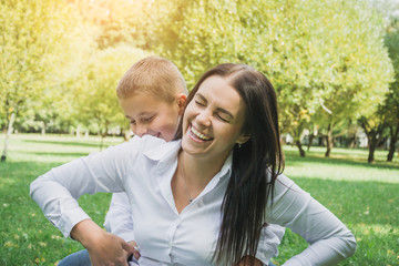 Fototapeta premium little eight years old boy with his mother portrait