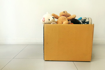 Dolls and shoes in donation box