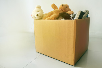 Dolls and shoes in donation box