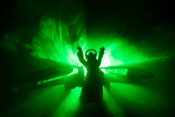 Scary view of zombies at cemetery dead tree, moon, church and spooky cloudy sky with fog, Horror...