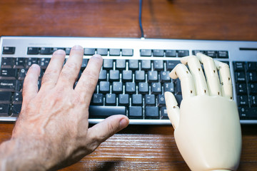 Real and prosthetic hand typing on a computer keyboard