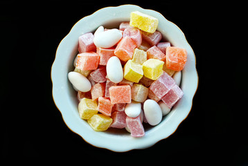 candy and delights on a plate isolated on white background