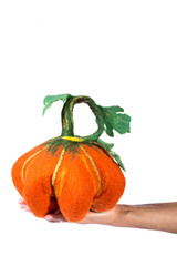 Obraz premium Pumpkin handmade from felted wool for celebration of Halloween