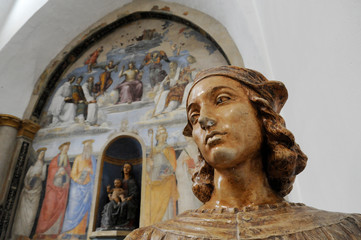 Bust of Raffaello Sanzio, known as Raphael. On the background there is a fresco painted by Raffaello Sanzio. Chapel of San Severo, Perugia, Italy