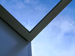 Structure of steel building construction with blue sky background.