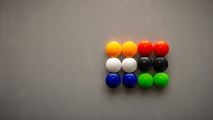 Colorful fridge magnet on the refrigerator.