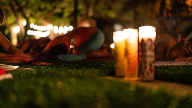 Yoga Stretching at Night by Candle Light