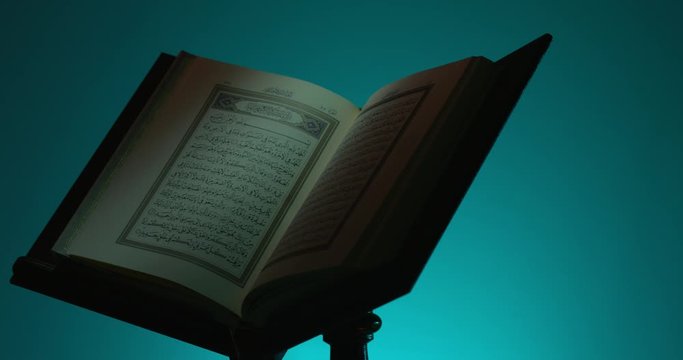 Holy Quran on Book Rest Rotation Partial Light