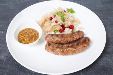 Grilled sausages with sauerkraut.