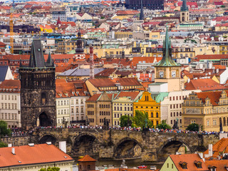 Prague, Czech Republic, detail of Charles bridge and its historic buildings with picturesque red roofs