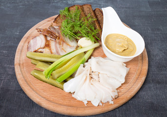 Assorted pork fat with pickles.