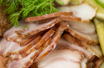 Assorted pork fat with pickles.