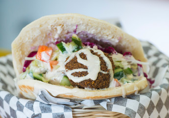 a falafel pita sandwich is shown