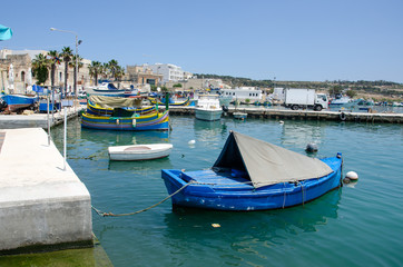 Fototapeta na wymiar Cityscape view of Marsaxlokk village port of Malta