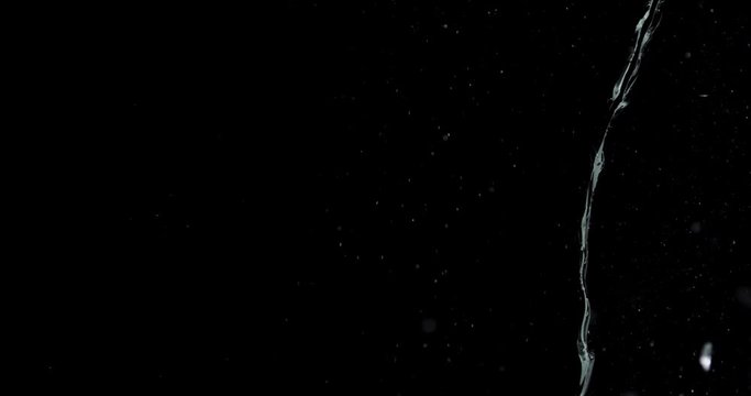 Shattered and broken glass shards flying through the air after crush broken window on a black background