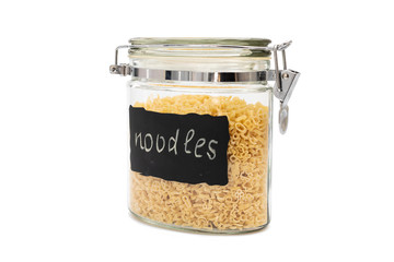 Noodles or pasta in a glass jar, flip-top or bail closure, isolated on white